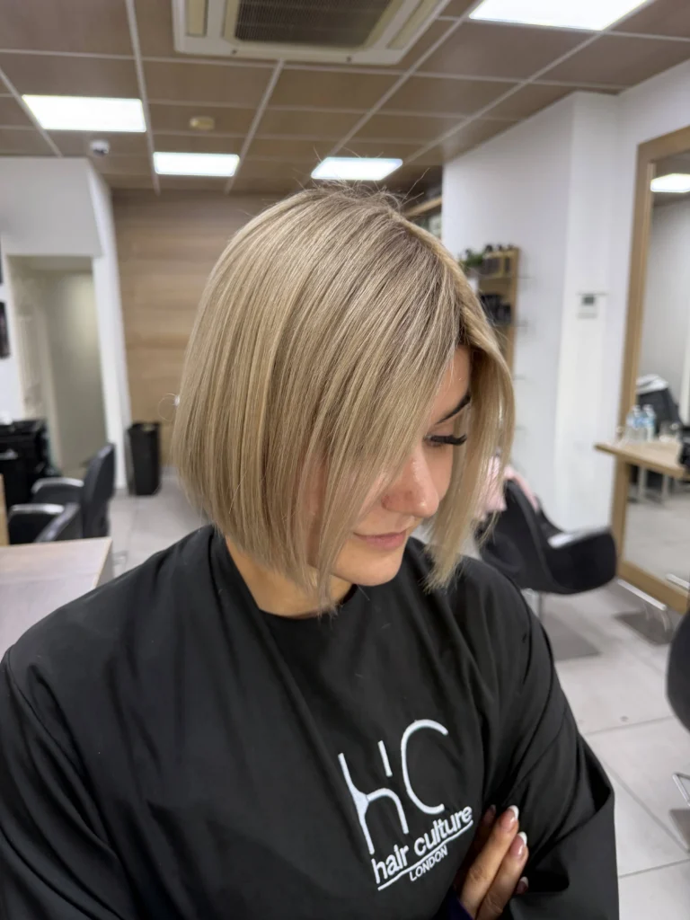Short blonde bob toned with Wella Supernatural at Hair Culture salon Leytonstone, soft pearl-sand tone with natural rooted finish