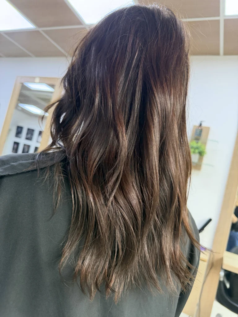 Long brunette hair coloured with Wella Supernatural at Hair Culture salon Leytonstone, showing refreshed depth and natural dimension through the lengths