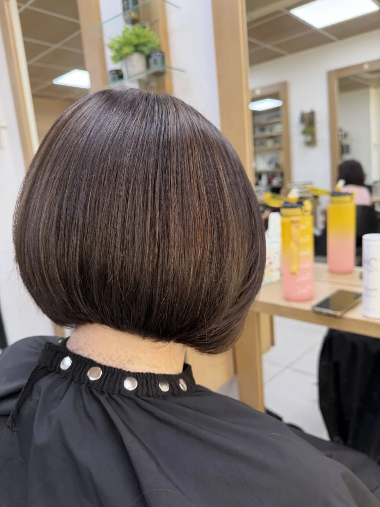 Deep chocolate brunette hair coloured with Wella Supernatural at Hair Culture salon Leytonstone, glossy waves and full strengthening tannin finish
